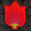 Marianne Aulman: Broche tulp, mixed media, 7 x 5 cm. 35 euro