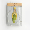 Wendy Limburg: Maria met licht (2025), aardewerk op hout, 21 x 13 cm. 80 euro